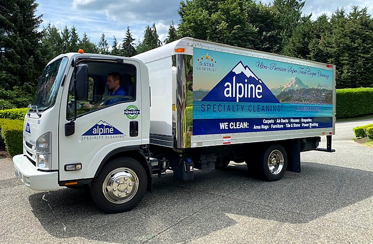 Alpine Specialty Services Super Truck parked in a Seattle-area driveway